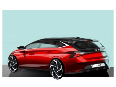 Štúdia nového modelu Hyundai i20 červenej farby na zelenom pozadí, pohľad z ľavej zadnej strany