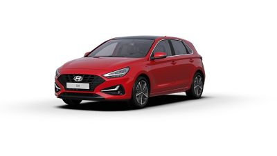 Front side view of the new Hyundai i30 in the colour Engine Red.