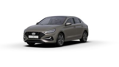 Front side view of the new Hyundai i30 Fastback in the colour Silky Bronze.