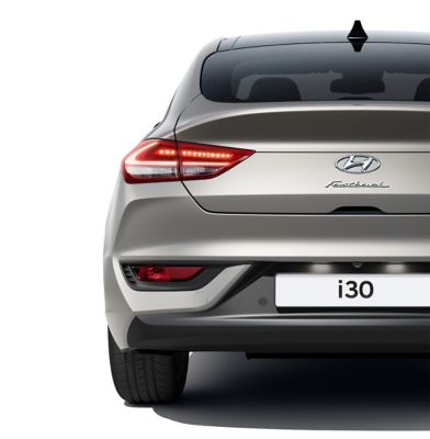 The new Hyundai i30 Fastback pictured from the rear, focused on the rear combination lamps.