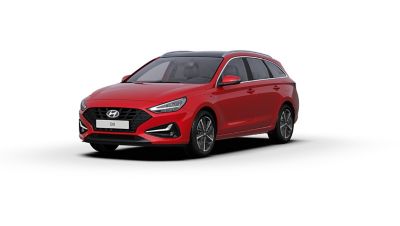 Front side view of the new Hyundai i30 Wagon in the colour Engine Red.