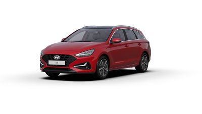 Front side view of the new Hyundai i30 Wagon in the colour Sunset Red.