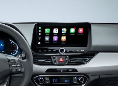 The new Hyundai i30 10.25" touchscreen with Apple CarPlay icons displayed.