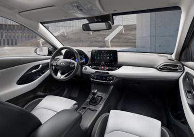 Front interior of the new Hyundai i30 as seen from the back seat