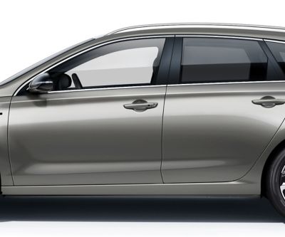 The new Hyundai i30 Wagon pictured from the driver side, focused on the doors roof, windows, and doors